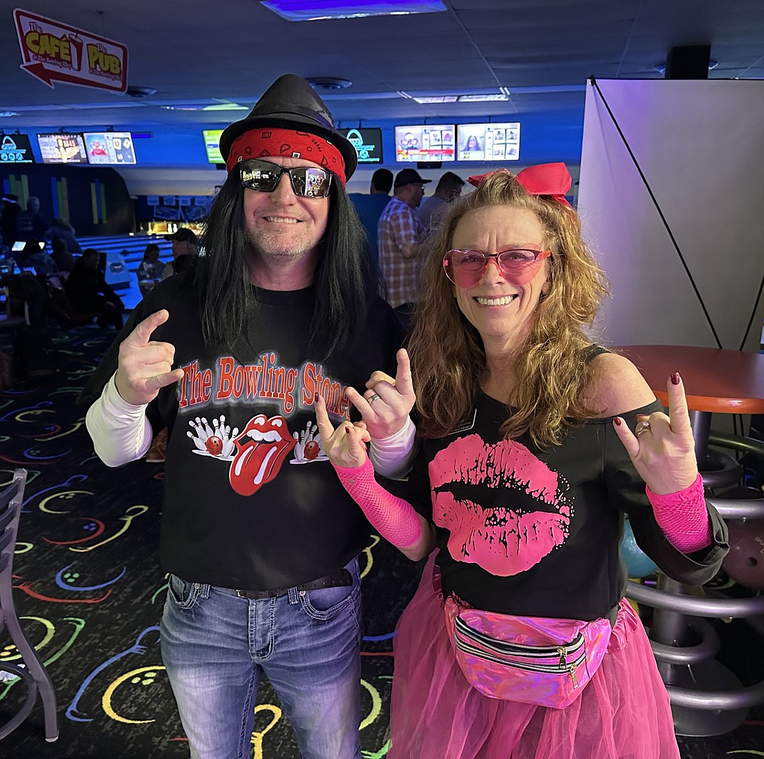 Tammy Smith (R), Big Brothers Big Sisters of Kosciusko County development director, poses for a photo with Rob Smith (L), Milford, during BBBS of Northeast Indiana’s Bowl for Kids’ Sake fundraiser event at The Bowling Alley, Warsaw, on Saturday. The theme for this year’s fundraiser is “Battle of the Bands.” Photo by David Slone, Times-Union