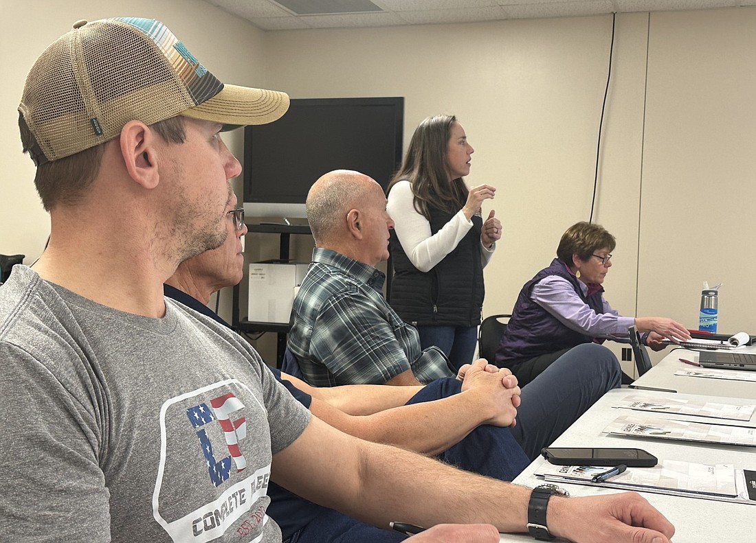 Katie Clark (standing), landscape architect and project manager at Taylor Siefker Williams Design Group, leads the exercises and discussion during Monday’s joint meeting of the Kosciusko County Parks and Recreation Board and master trails plan steering committee. Pictured seated (L to R) are Tim Metzger, Warsaw Parks and Recreation Department Superintendent Larry Plummer, Winona Lake Town Manager Craig Allebach and Deb Schmucker, president and CEO of Cornerstone Planning & Design. Photo by David Slone, Times-Union