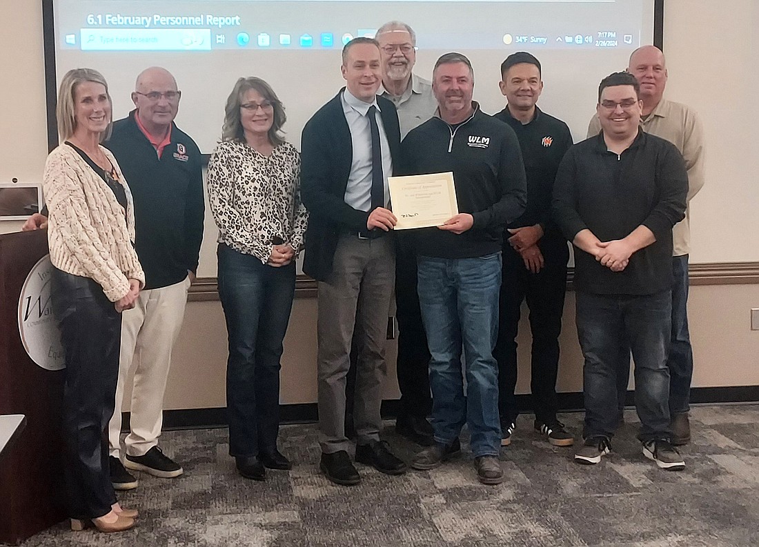 The Warsaw School Board recognized Joel Wihebrink, of Wihebrink Landscape Management, Monday. Photo by Jackie Gorski, Times-Union