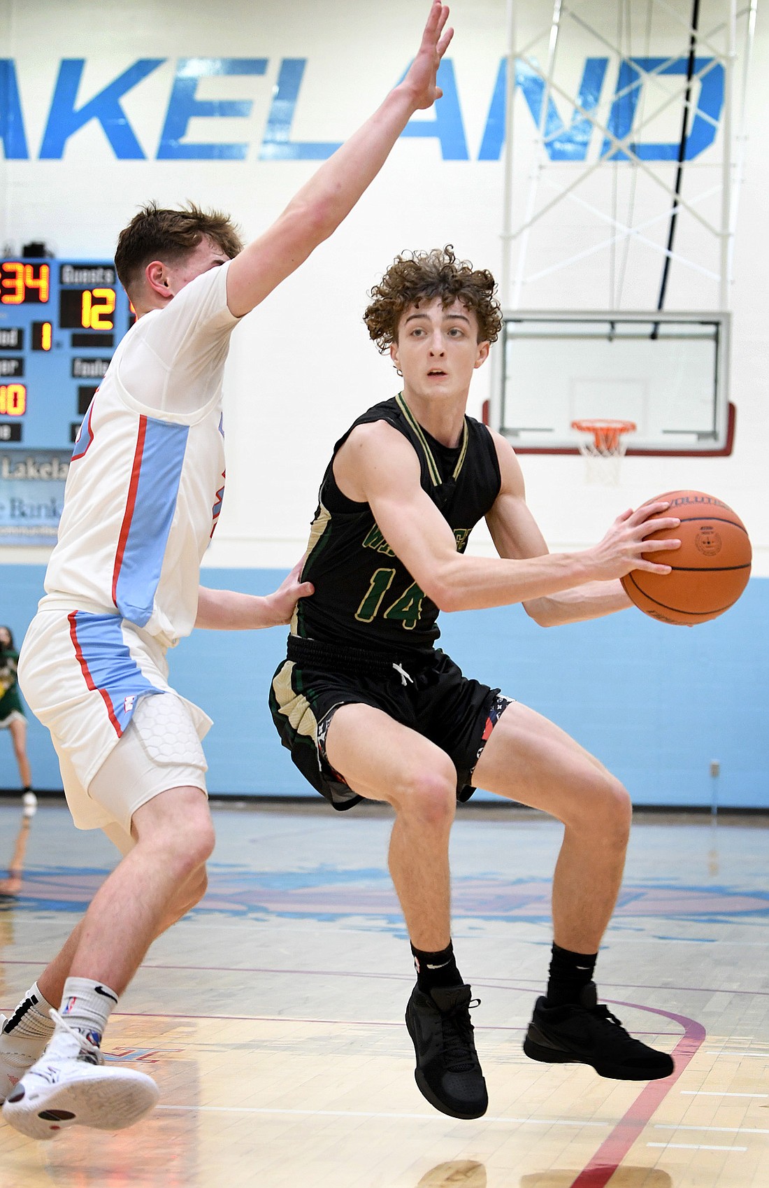 Sophomore Nolan Holzwart of Wawasee hops down the lane during Tuesday night's sectional game against Lakeland. Photo by Gary Nieter