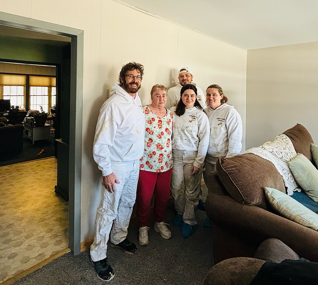 Pictured (L to R) are Jason Matthews, Matthews Painting Company; Deb Goble, Paint It Forward winner; Jamey Shirk, Roger Levitz and Amanda Richards. Photo Provided.