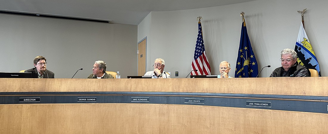 Community and Economic Development Director Jeremy Skinner (far left) explains the agreement with NIPSCO to Warsaw Redevelopment Commission members (L to R) George Clemens, president; Mike Klondaris, vice president; Jack Wilhite, city councilman; and Joe Thallemer, former mayor. Photo by David Slone, Times-Union