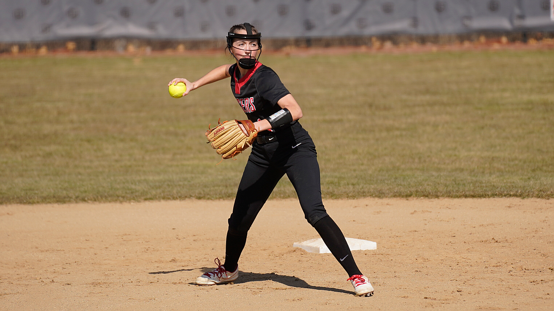 Halle Nett sets her feet before firing a strike to first base. The Grace Lancers softball team will be busy this week in Florida.