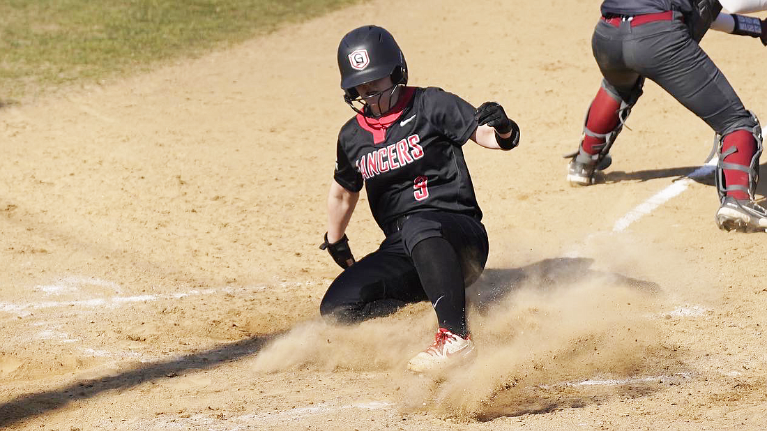 Pictured is Grace’s Jeri Ellis scoring a run.