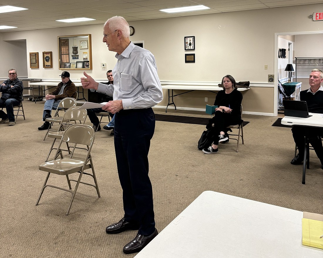 Milford resident Ron Baumgartner spoke to the Milford Town Council at Monday’s meeting, asking them to reconsider their recent decision regarding water fluoride treatment. In back (right) is Dr. Steven Hollar, DDs and to the left, Jessica Miller. Photo by Denise Fedorow