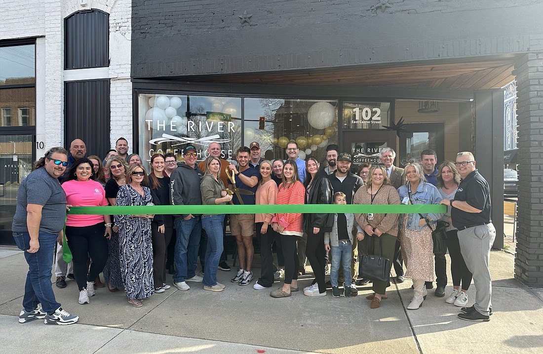 Kosciusko Chamber of Commerce had a ribbon-cutting ceremony Tuesday for The River Coffeehouse, 102 E. Center St., Warsaw. The River Coffeehouse also is located in North Webster. Photo by David Slone, Times-Union