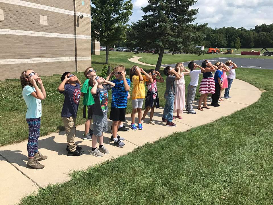 Harrison Elementary School students are seen participating in the 2017 solar eclipse. Photo Provided