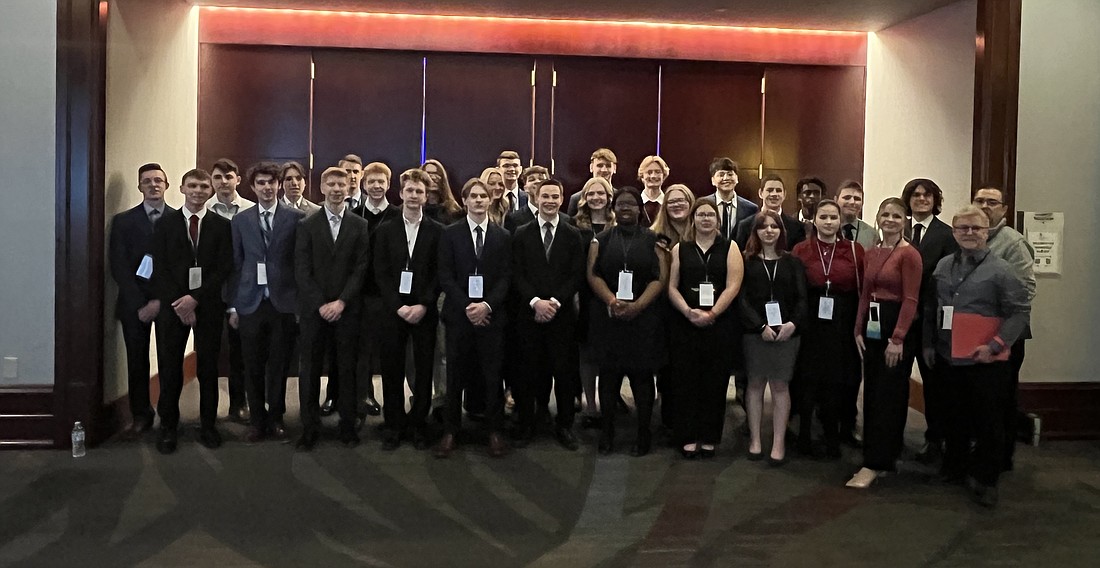 Pictured are members and advisors of the Warsaw Area Career Center BPA Chapter at the State Leadership Conference. Photo Provided.