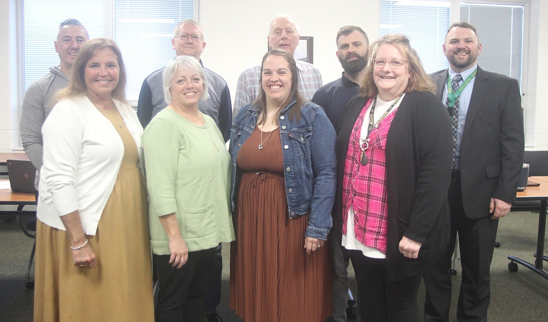 The Wawasee Community School Board honored multiple teachers for winning awards and earning certifications. Pictured (L to R) are, front row: Shelly Judy, Teresa Wiedeman, Carlye Phagan Snider, Carla Winegardner; back row: board members Steve Baut, Mike Wilson, Don Bokhart, Neil Likens and Superintendent Dr. Steve Troyer. Photo by Marissa Sweatland, InkFreeNews