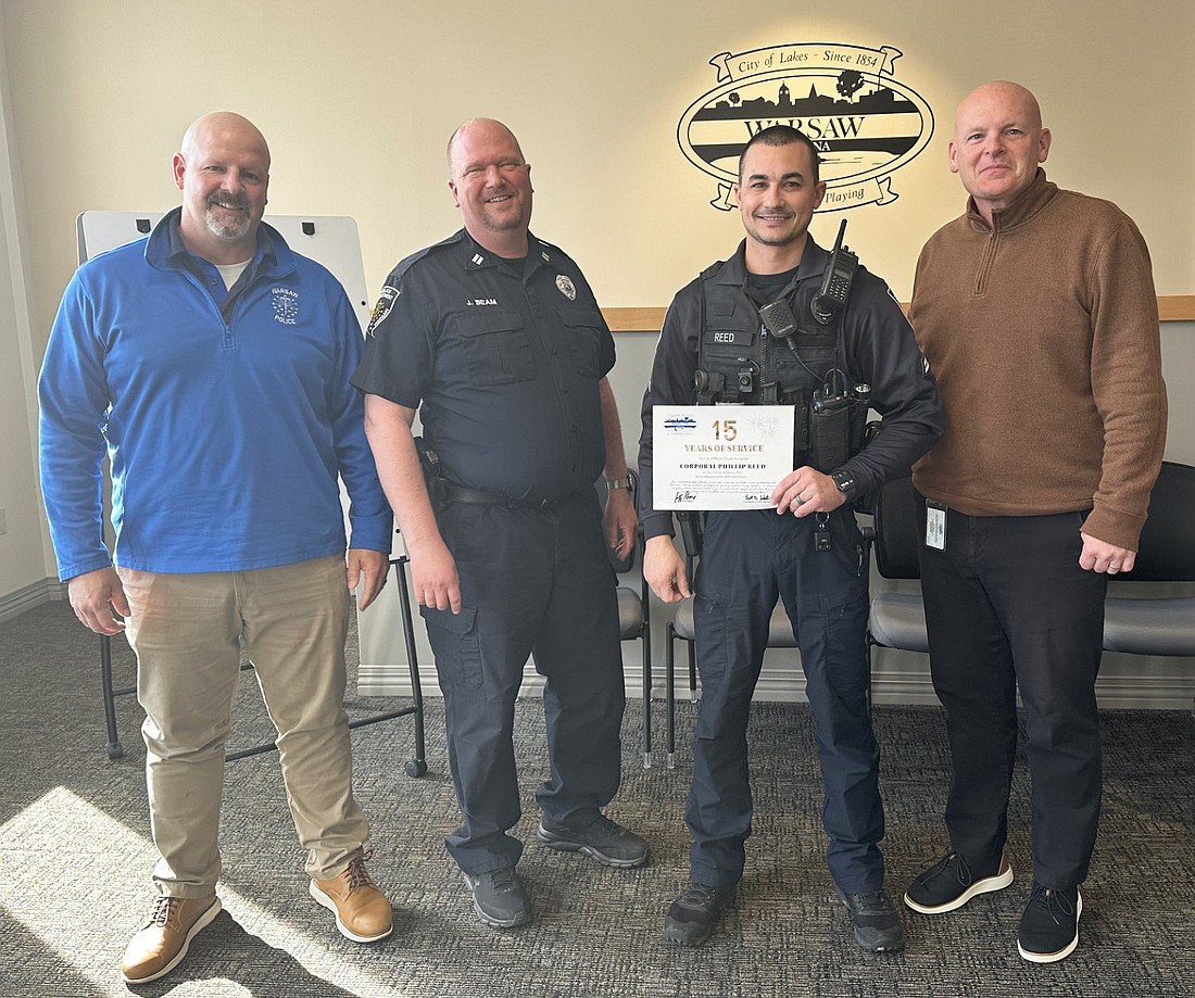 City of Warsaw Human Resource Directory Denny Harlan recognized two city employees at Friday’s Board of Public Works and Safety meeting for their milestone anniversaries in March. Warsaw Police Department Cpl. Phillip Reed has served Warsaw for 15 years, while Capt. Joel Beam has worked for the city for 25 years. Pictured (L to R) are WPD Chief Scott Whitaker, Beam, Reed and Mayor Jeff Grose. Photo by David Slone, Times-Union