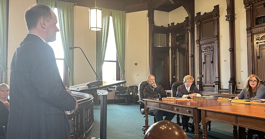 Dr. Rob Ryan (standing), CEO of The Bowen Center, speaks to the Kosciusko County Council Thursday night. Pictured sitting (L to R) are Council members Dave Wolkins, Sue Ann Mitchell and Kathleen Groninger. Photo by David Slone, Times-Union