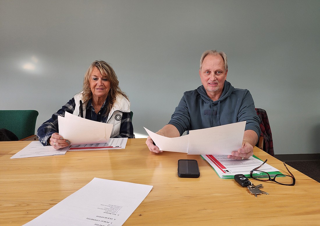 North Webster Town Council members Lisa Strombeck and David Waliczek look over paperwork during the North Webster Town Council meeting Tuesday. Photo by Deb Patterson, InkFreeNews