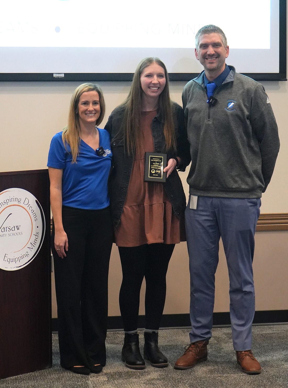 Pictured (L to R) are Cassie Frank, Dog Training Elite; Ava Hoops, Leesburg special education teacher; and Nathan Polston, Leesburg Elementary School principal. Photo Provided