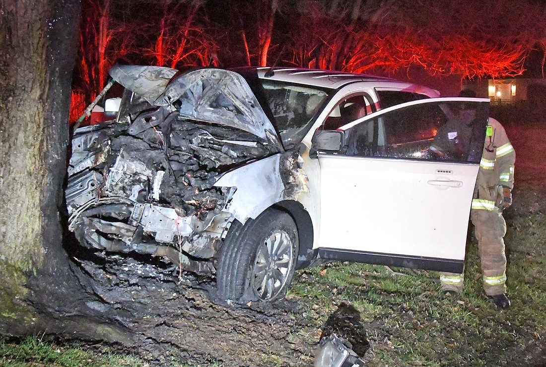 Warsaw firefighters check out the scene of Monday's predawn single-vehicle accident on Ferguson Road, east of Ind. 25. Photo by Gary Nieter, Times-Union.