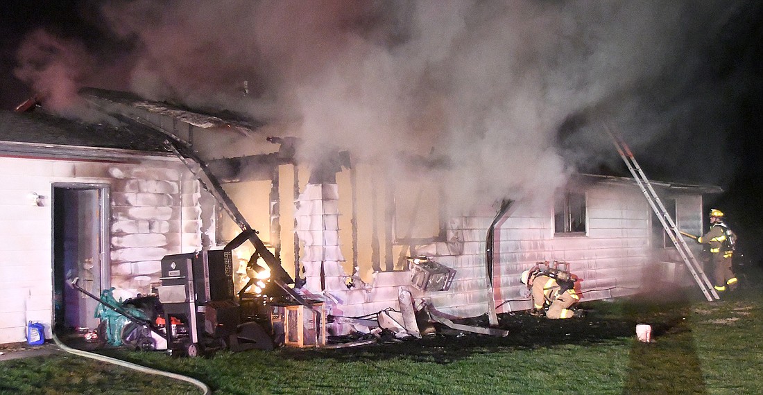 Multiple fire departments responded to Monday night's house fire on Sandy Drive. Photo by Gary Nieter, Times-Union