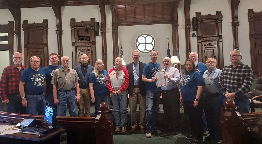 Pictured are Kosciusko County Commissioners Cary Groninger, Brad Jackson and Bob Conley and members of Echoes of the Past at the commissioners meeting Tuesday. Photo by Jackie Gorski, TIMES-UNION