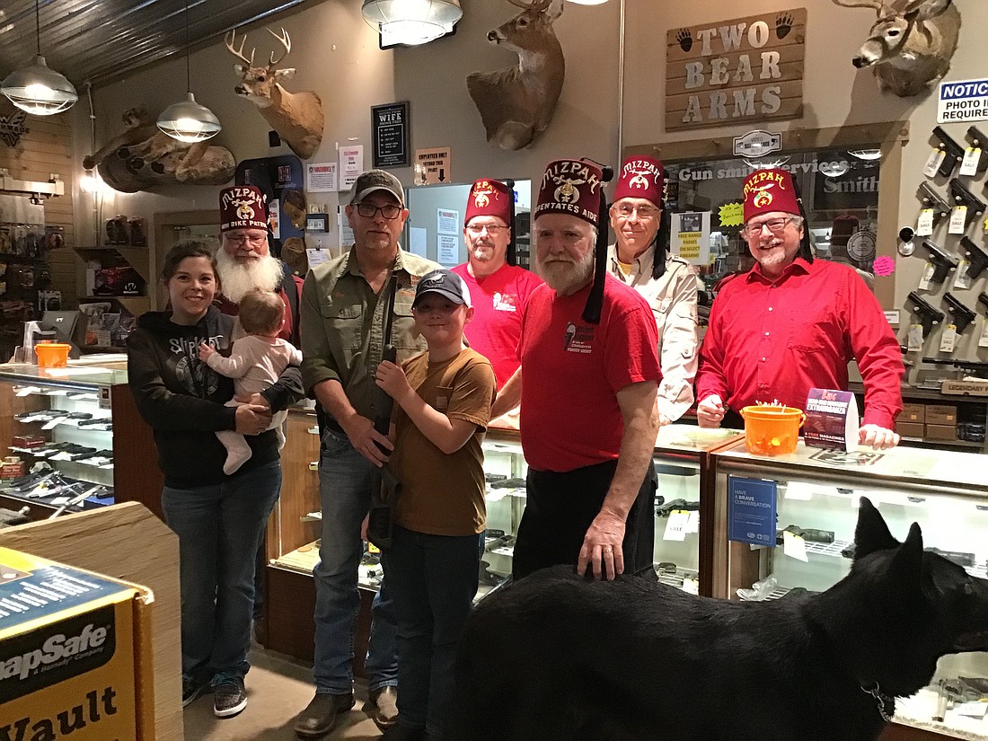 Pictured (L to R) are, front row: Kelly Elliott, Emily Elliott, Wyatt Elliott (winner of the youth 410 shotgun donated by Two Bear Arms, Don Wallen and Don Smith; back row: Scott Wallace, Randy Riner, John Sadler and Jim Brennan. Not pictured is Brian Robinson, winner of the Henry .22 cal rifle donated by McHatton-Sadler Funeral Home. Photo Provided.