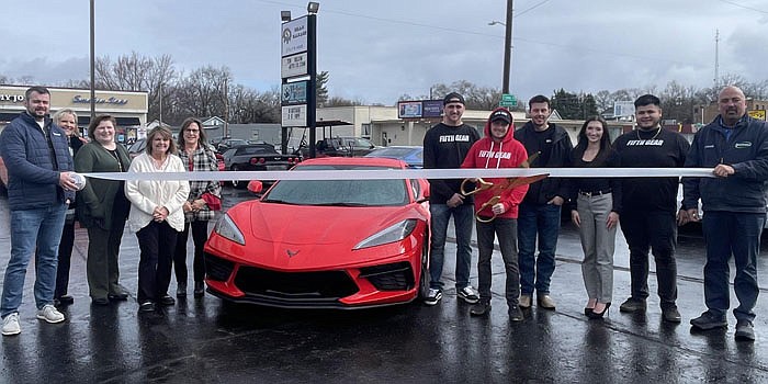 Fifth Gear Garage celebrated the opening of its second location in Warsaw with a ribbon-cutting hosted by the Kosciusko Chamber of Commerce on Wednesday. Pictured (L to R) are Josh Silveus, Wende Roberts, Debora Eichman, Dawn Jaggers, and Tracy Speigle, all Chamber ambassadors; Tristyn Tenney, Jordan Greenberg, Johnny Arnett, Destiny Jade, and Juan Bernal, all of Fifth Gear Garage; and Kosciusko Chamber of Commerce Member Relations Manager Scott Wiley. Photo by Liz Shepherd, InkFreeNews