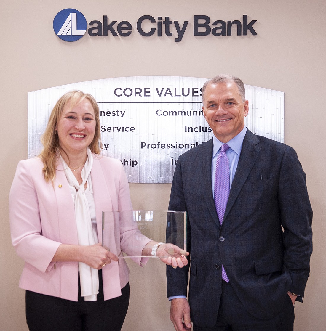 David Findlay (R), Lake City Bank chairman and chief executive officer, is pictured with Stacy Price, Lake City Bank vice president, financial analyst, the 2023 recipient of Lake City Bank’s Commitment Award. Photo Provided.