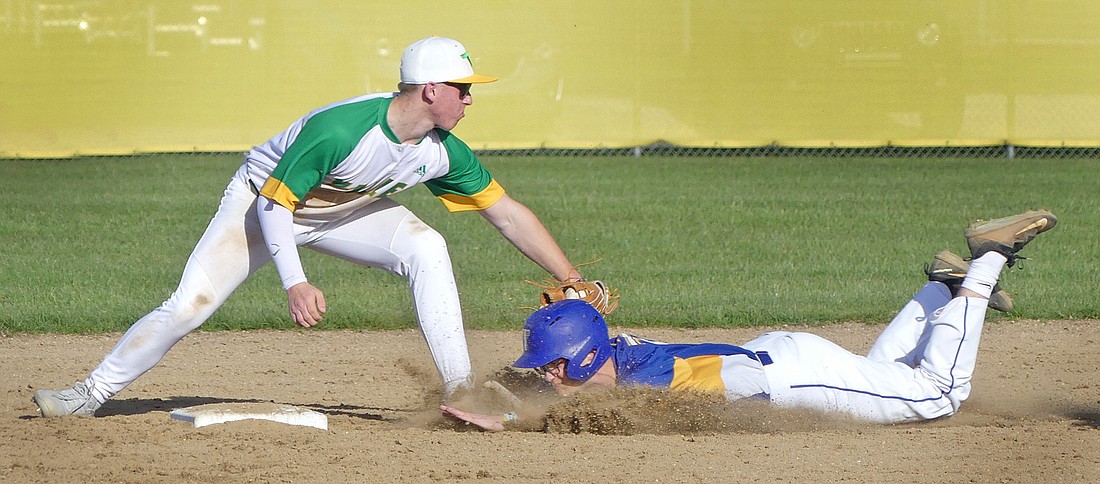 Triton senior Zak Greer unsuccessfully tries to stretch a single into a double during the fourth inning as Valley's Gage Hileman puts the tag on him. Photo by Gary Nieter
