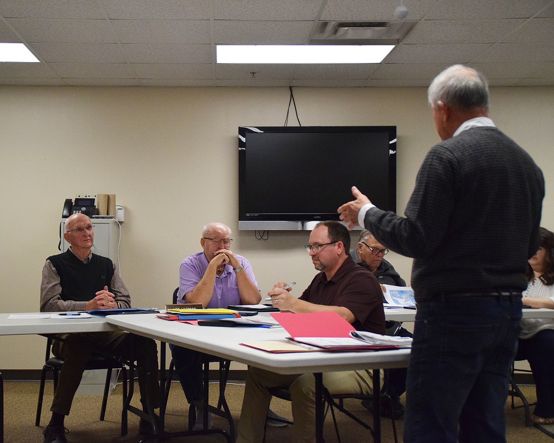 Mike Arndt speaking in front of (L to R) Lee Harman and Randy Cox. In the middle is Matt Sandy. Photo by Lauren Zeugner, InkFreeNews