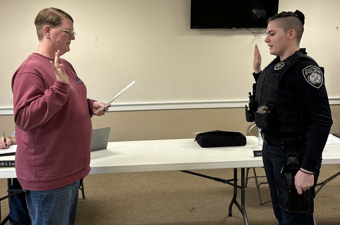 Milford Clerk-Treasurer Tricia Gall (L) swears in new officer Allie Sloane at the Milford Town Council meeting Monday evening. Photo by Denise Fedorow