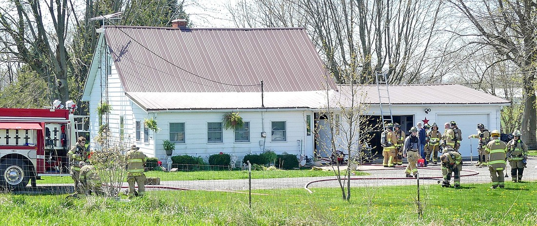 Fire crews were able to quickly knock down Monday afternoon's house fire on County Farm Road, near CR 1100S. Photo by Gary Nieter, Times-Union