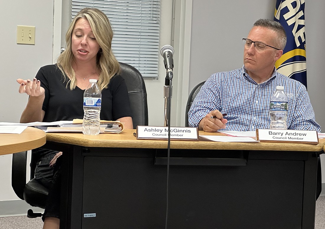 Winona Lake Town Councilwoman Ashley McGinnis (L) talks about a clarification for the farmers market agreement Tuesday as Councilman Barry Andrew (R) listens. Photo by David Slone, Times-Union