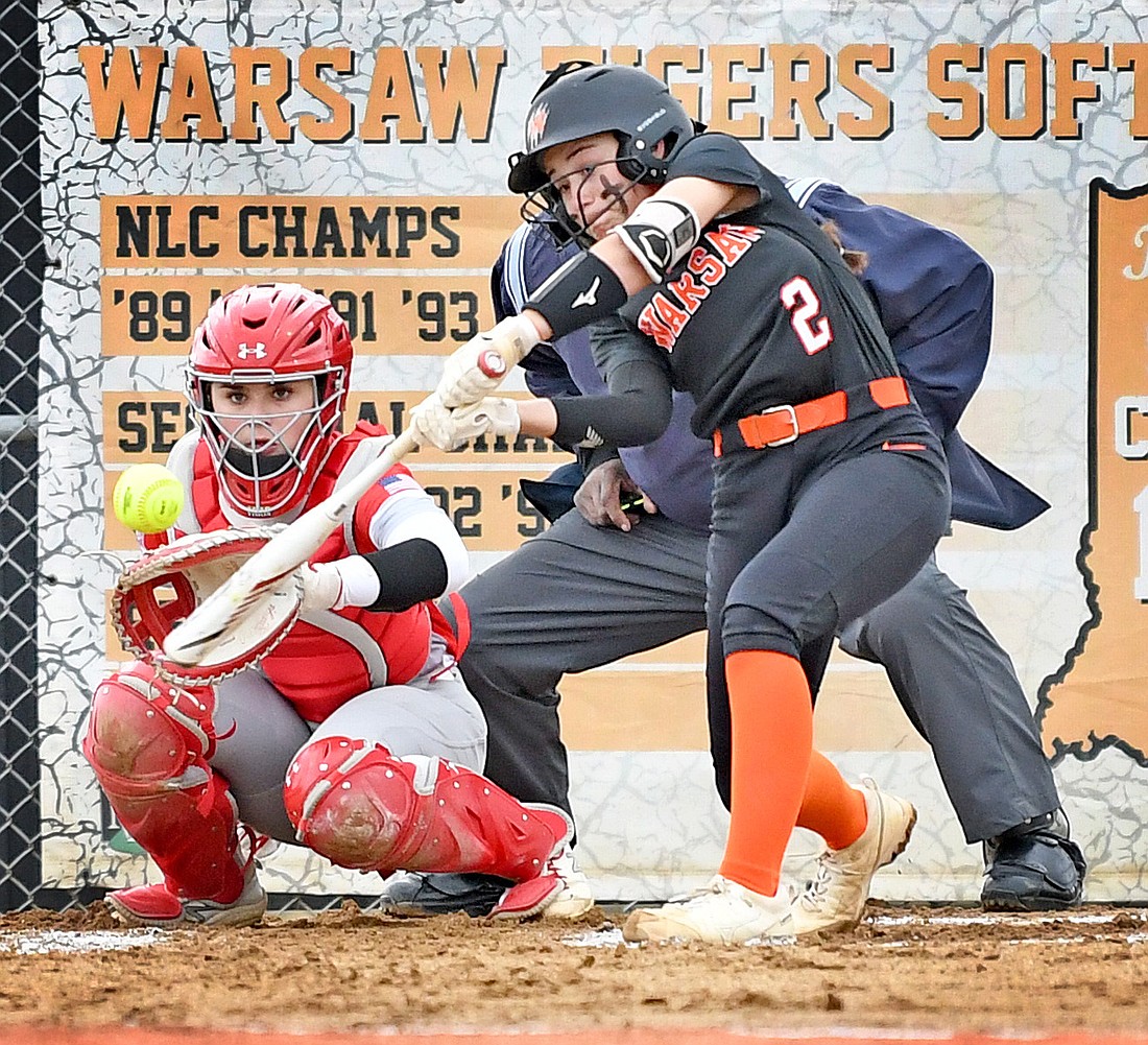 Junior Mia Rodriguez hits a single en route to scoring Warsaw's first run of the game in the first inning. Photo by Gary Nieter
