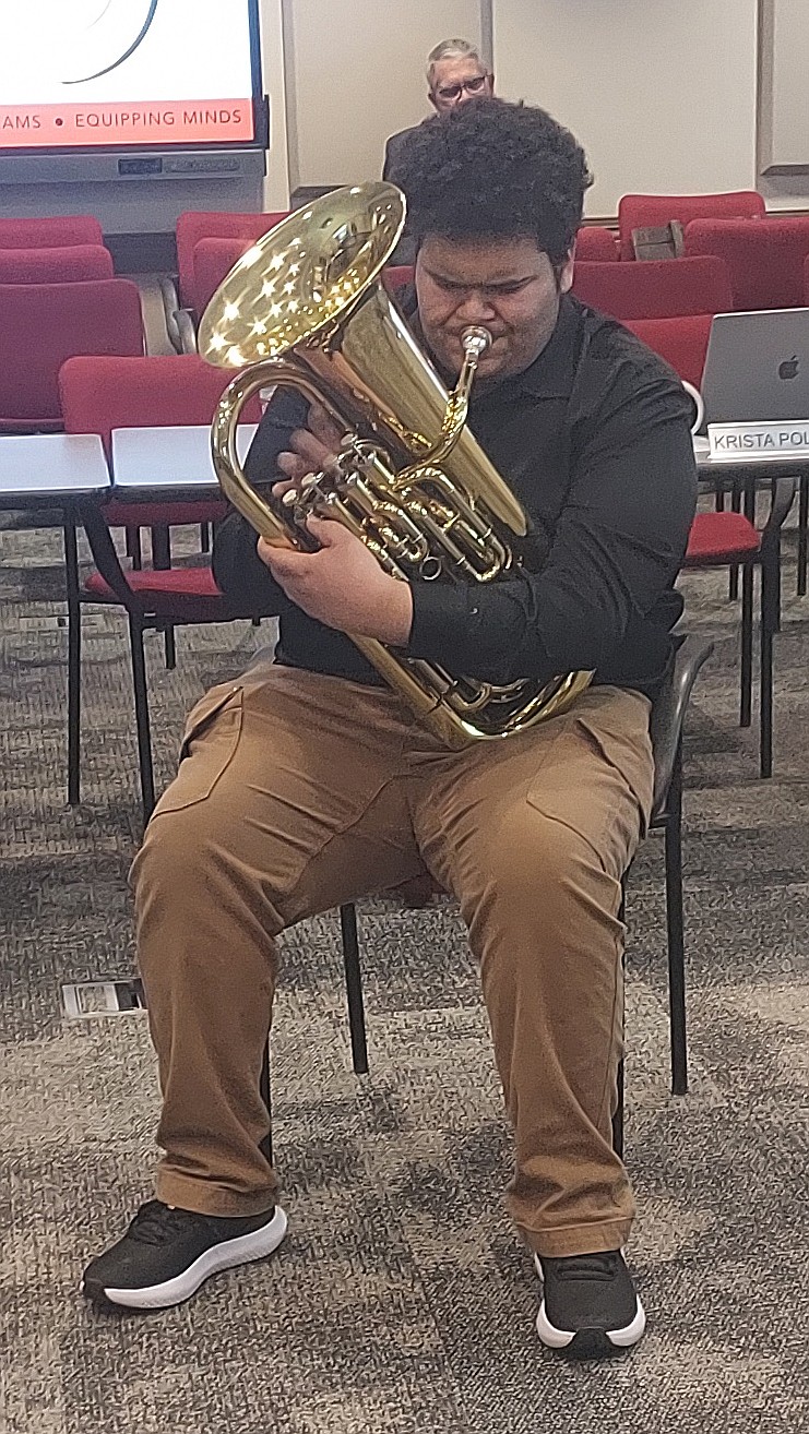 Warsaw Community High School student Mattix Garrett performs a baritone solo for the Warsaw School Board Monday. Photo by Jackie Gorski, Times-Union