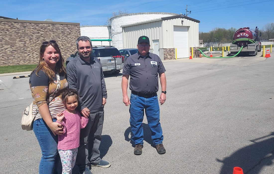 Warsaw Wastewater Utility employee Greg Webber gives Brenna, Joe and Emerson Blazek a tour of the facilities Monday. Photo by Jackie Gorski, Times-Union