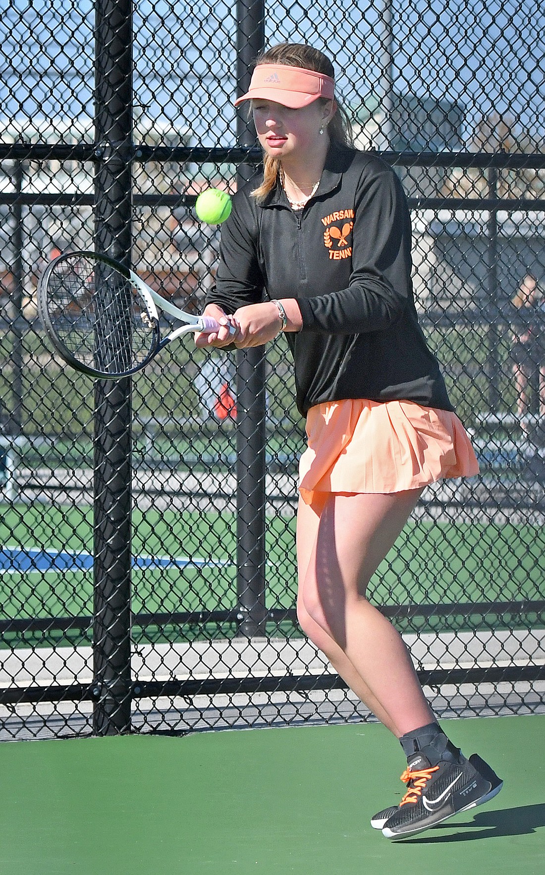 Warsaw's Addie Lind makes a return during her No. 1 singles home match against Wawasee Thursday evening. Photo by Gary Nieter
