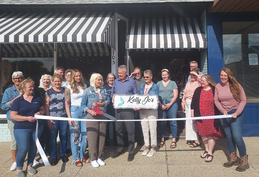The Pierceton Chamber of Commerce held a ribbon-cutting Thursday for Kelly Jo’s. Pictured are Chamber members, owners Kelly Jo and David Jost and area business members, family and friends. Photo by Jackie Gorski, Times-Union