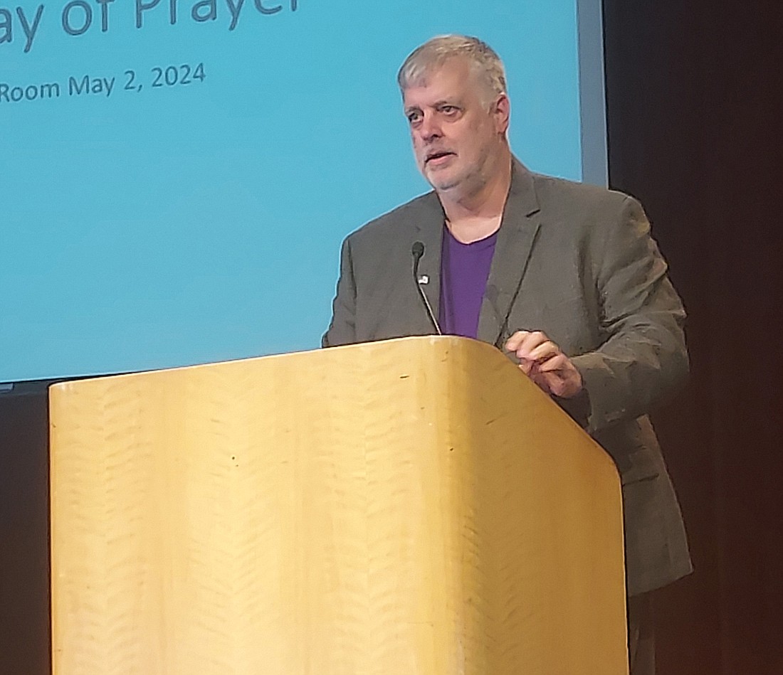 Master of ceremonies Ken Locke speaks at the National Day of Prayer at the Winona Heritage Room Thursday. Photo by Jackie Gorski, Times-Union