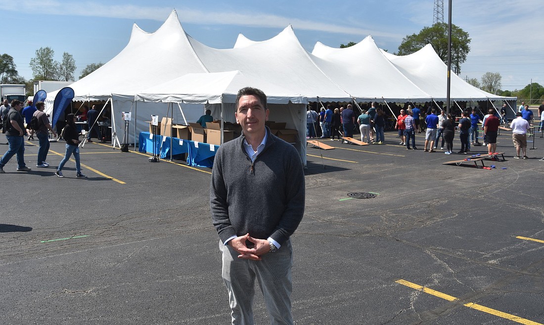 Zimmer Biomet CEO Ivan Tornos poses for a photo outside of a tent at Zimmer Biomet Building 5. Photo by Patrick Webb, InkFreeNews