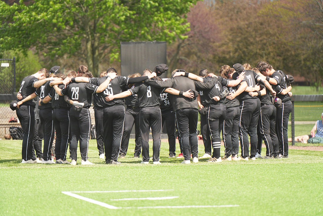 Pictured is Grace in a team huddle.