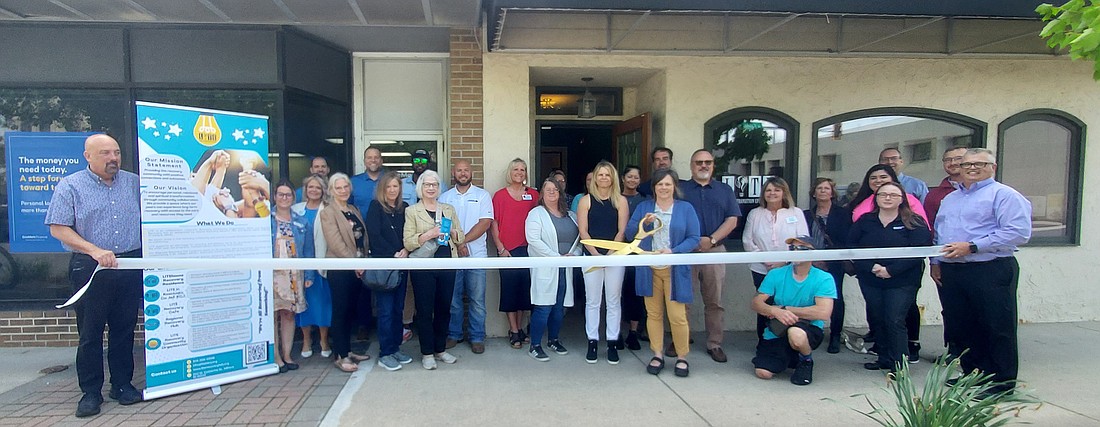 Kosciusko Chamber of Commerce held a ribbon-cutting for Living in Transition Effectively Monday. Pictured are Chamber staff and ambassadors, LITE staff and community members. Photo by Jackie Gorski, Times-Union