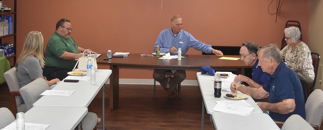 Pictured at the Kosciusko County Solid Waste Management District Board meeting Monday are (L to R) Winona Lake Councilwoman Ashley McGinnis, Kosciusko County Solid Waste Management District Executive Director Tom Ganser, Board President and County Commissioner Brad Jackson, Kosciusko County auditor’s office member Becky Dye, Warsaw Common Councilman Jerry Frush and Kosciusko County Councilman Dave Wolkins. Photo by Patrick Webb, InkFreeNews