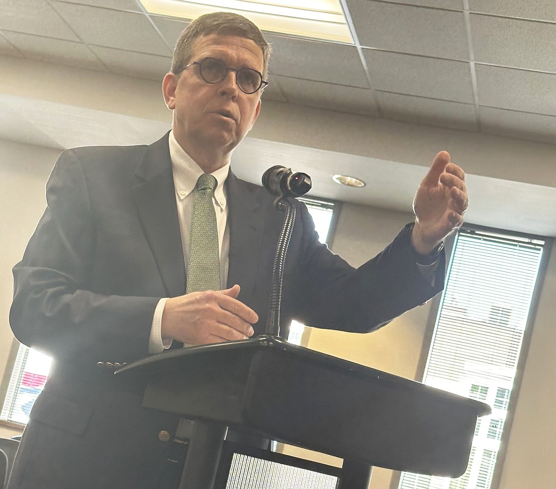 Randy Rompola, legal counsel with Barnes & Thornburg, explains the purpose of one of the three resolutions before the Warsaw Redevelopment Commission on Monday. Photo by David Slone, Times-Union