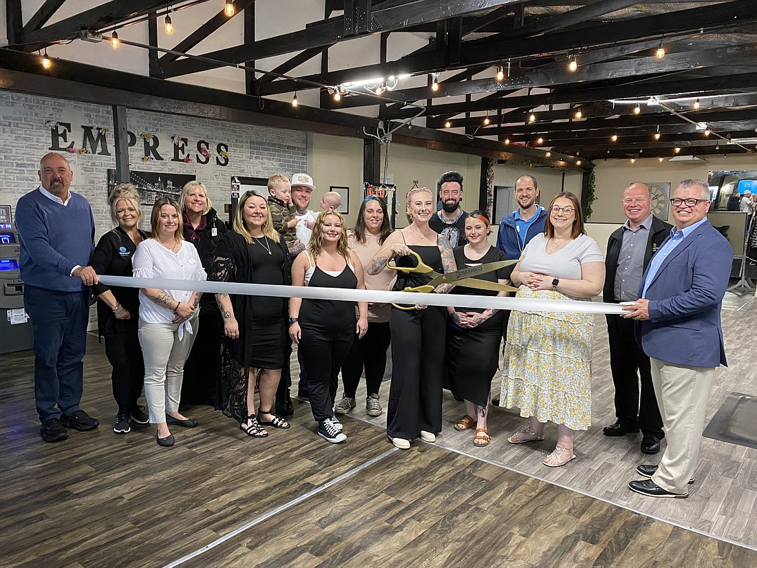 The Kosciusko Chamber of Commerce had a ribbon-cutting for Empress Beauty Salon, 970 N. Lake St., Warsaw, on Thursday. Pictured (L to R) are, front row: Chamber Member Relations Manager Scott Wiley; Chamber ambassadors Stacey Leek and Melissa Paxton; salon employees Bree Davis and Victoria Kratzchmar; salon owner Carley Powell; salon employee Breanna Mills; and Chamber President and CEO Rob Parker; back row: Chamber ambassador Wende Roberts; Powell's husband Sage Powell holding their kids Skyler Powell (L) and Everly Powell; salon employee Kara Stevens; Chamber ambassador Nathan Underneath; salon employee Cierra Cole; and Chamber ambassadors Jon Vida and Troy Galbraith. Photo by Leah Sander, InkFreeNews