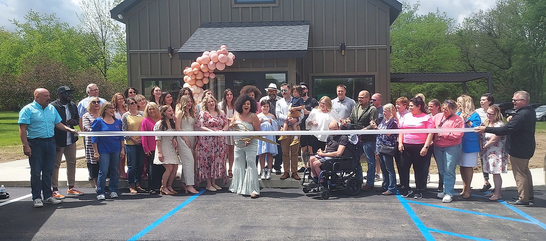 Kosciusko Chamber of Commerce held a ribbon-cutting for Infinity Salon, 1921 Plaza Drive, Warsaw, Friday. Pictured are Chamber staff and ambassadors, Infinity Salon staff and family and friends. Photo by Jackie Gorski, Times-Union