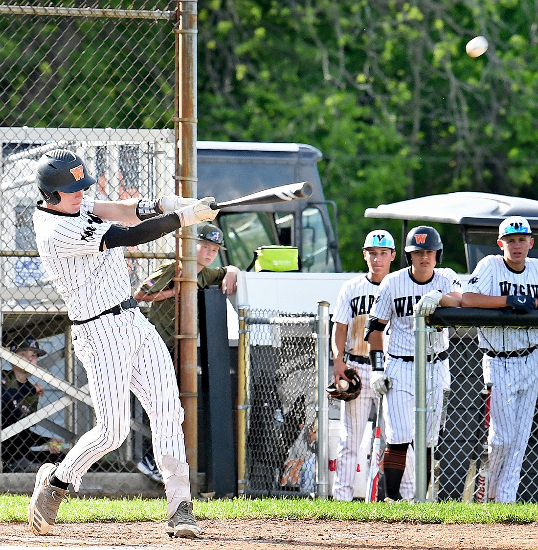 Junior Kellen Bailey of Warsaw hits the ball deep to left field to score a runner from third during the first inning...Nieter