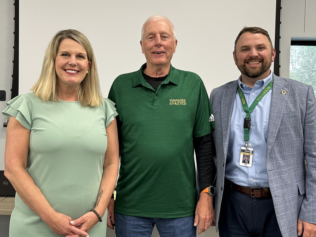 Karen Brock officially became the new principal of Syracuse Elementary School. She received a warm welcome at the Wawasee School Board’s regular meeting Tuesday. Pictured (L to R) are Brock; Don Bokhart, board president; and Dr. Steve Troyer, superintendent. Photo by Marissa Sweatland, InkFreeNews