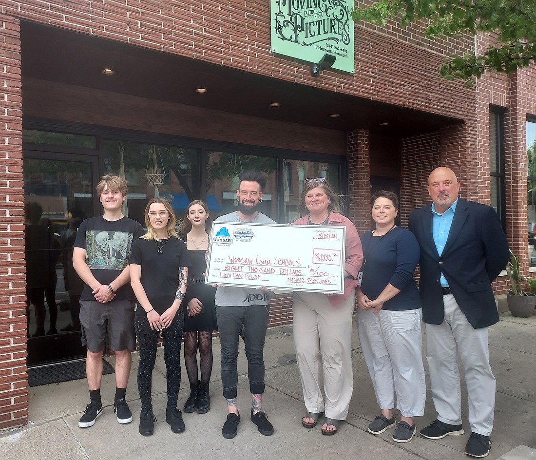 Pictured (L to R) are Jack Moeller, Alex Neff, Calissa Grindle and Nathan Underneath, of Moving Pictures Tattoo Cinema; Stacie Light, food service director at Warsaw Community Schools; Shannon Dellinger, assistant director of food services at WCS; and Scott Wiley, member relations manager at the Kosciusko Chamber of Commerce. Photo by Jackie Gorski, Times-Union