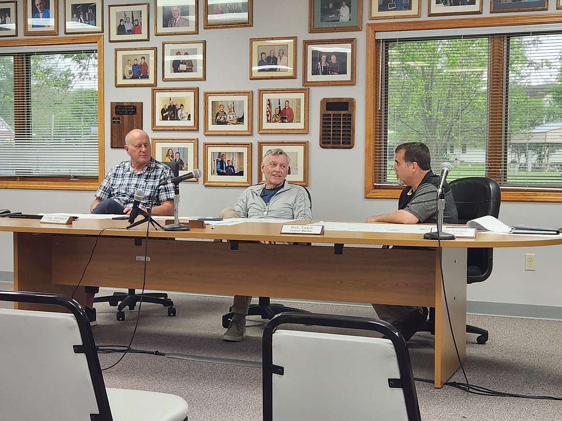 Winona Lake Town Manager Craig Allebach (L) listens to Winona Lake Plan Commission member Bill Zimmer (C) and Winona Lake town engineer Aaron Carl (R) discuss a request by Winona Lake Grace Church. Photo by Patrick Webb