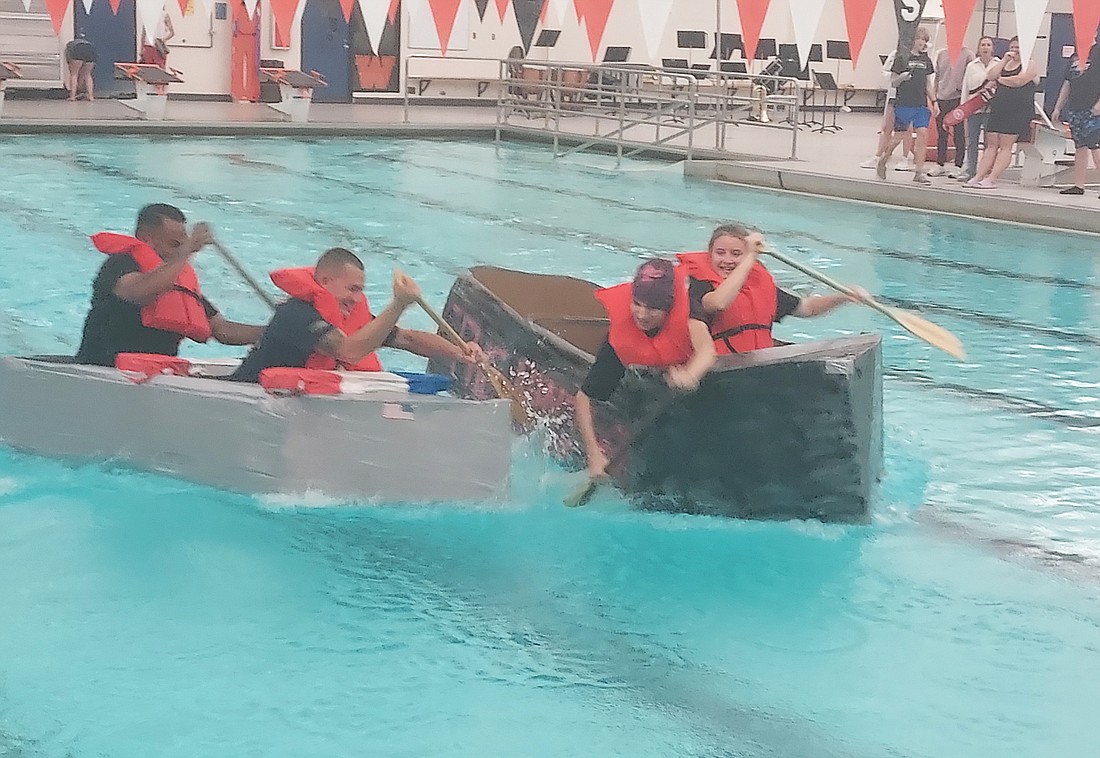 Edgewood Middle School students race in cardboard boats in the Warsaw Community High School pool on Friday. Photo by Jackie Gorski, Times-Union