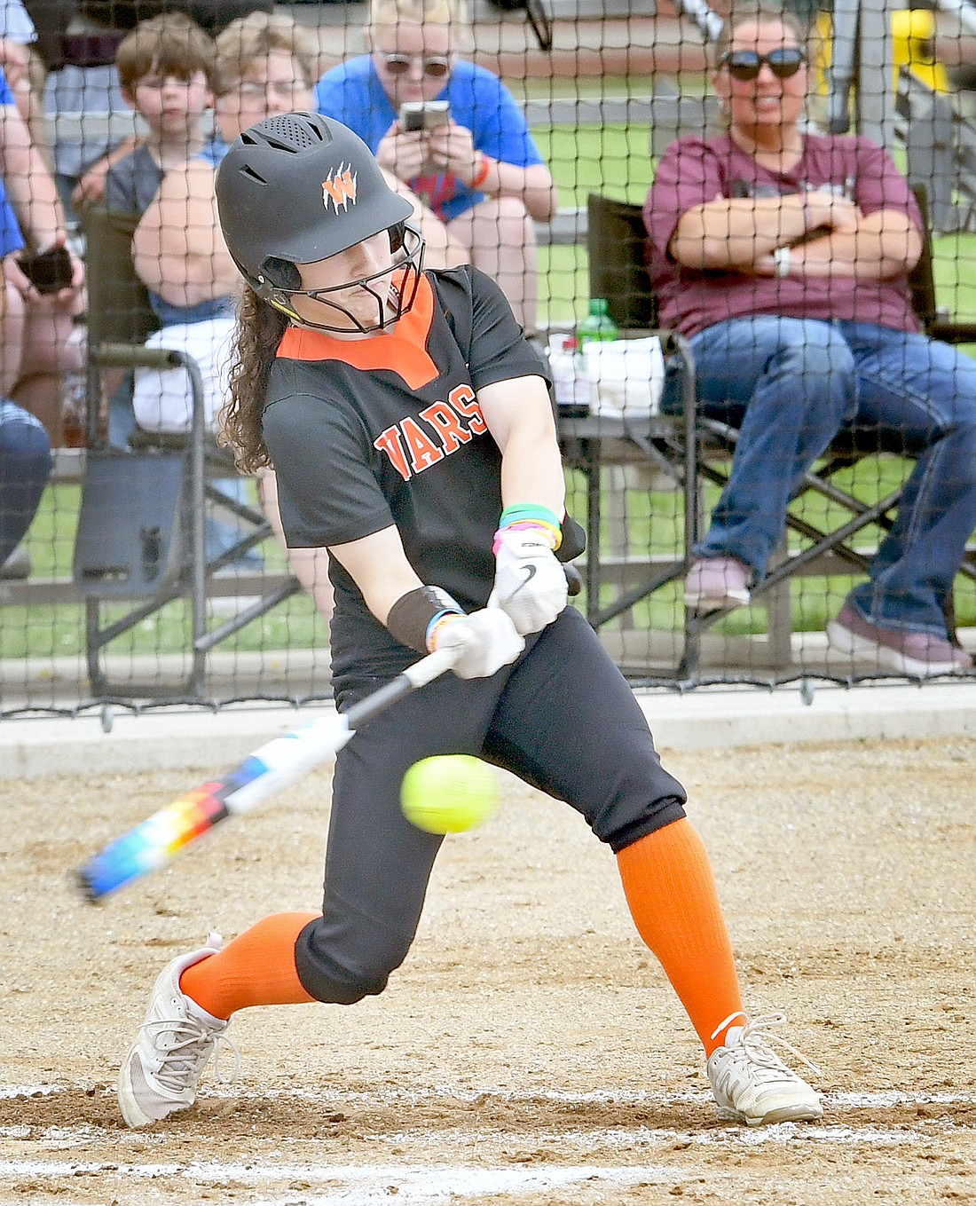 Freshman Addyson Sainer of Warsaw meets up with the ball for a hit during the second (?) inning...Nieter