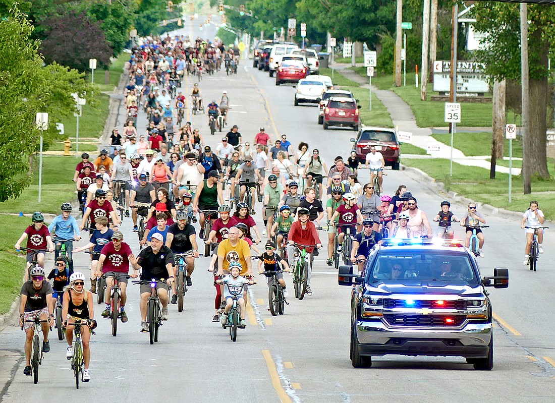 Bikers are given a police escort westbound on Center Street to the court house to kick off this weekend's Fat and Skinny Bike Fest. Photo by Gary Nieter, Times-Union