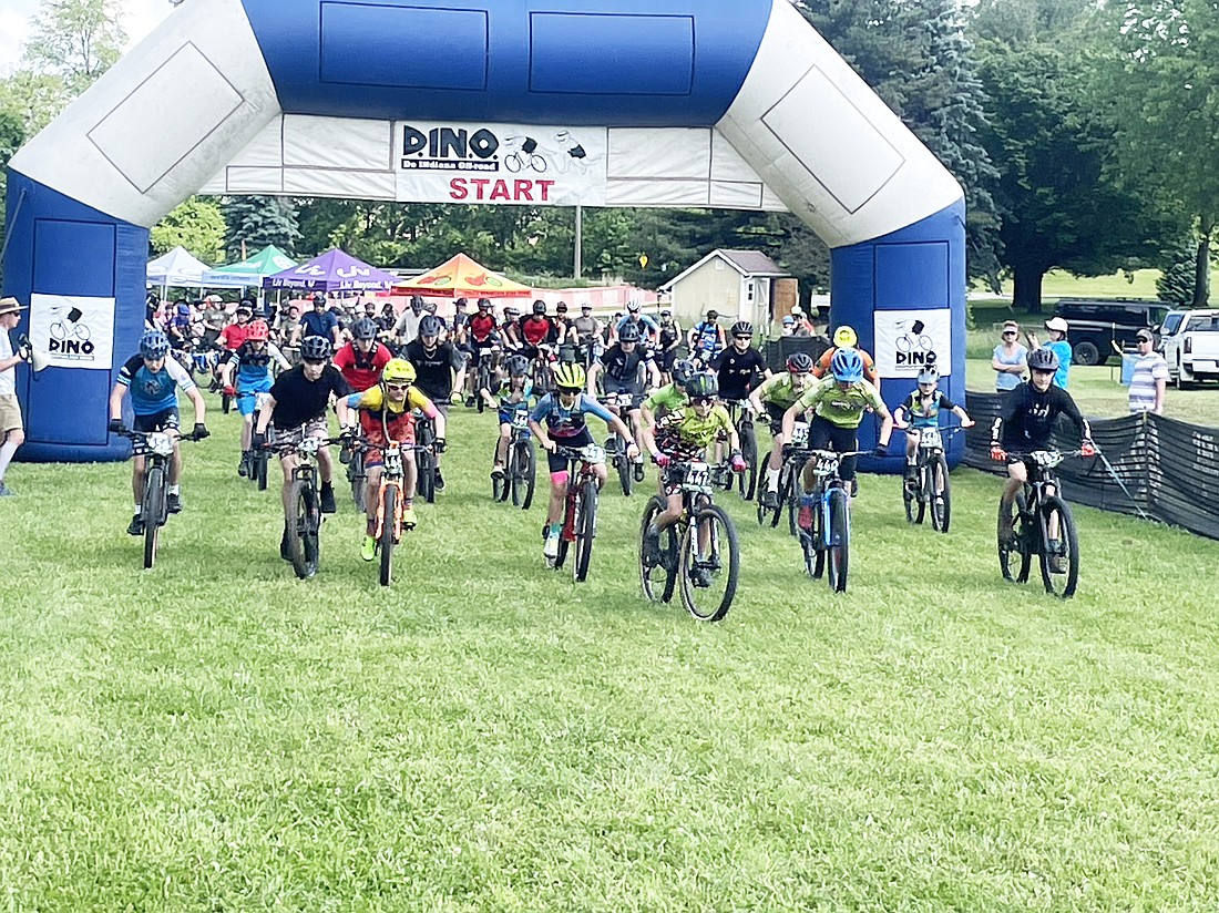A race at Saturday’s D.IN.O Mountain Bike Series begins at Winona Lake Saturday afternoon, as racers begin from the starting line.