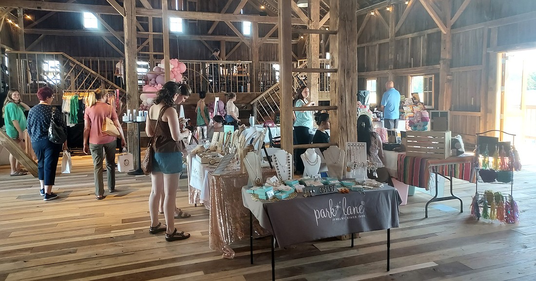 People take a look around at the Women Owned Business Market on Sunday at The Barn 1880, 2076 N. CR 100E, Warsaw. Photo by Jackie Gorski, Times-Union